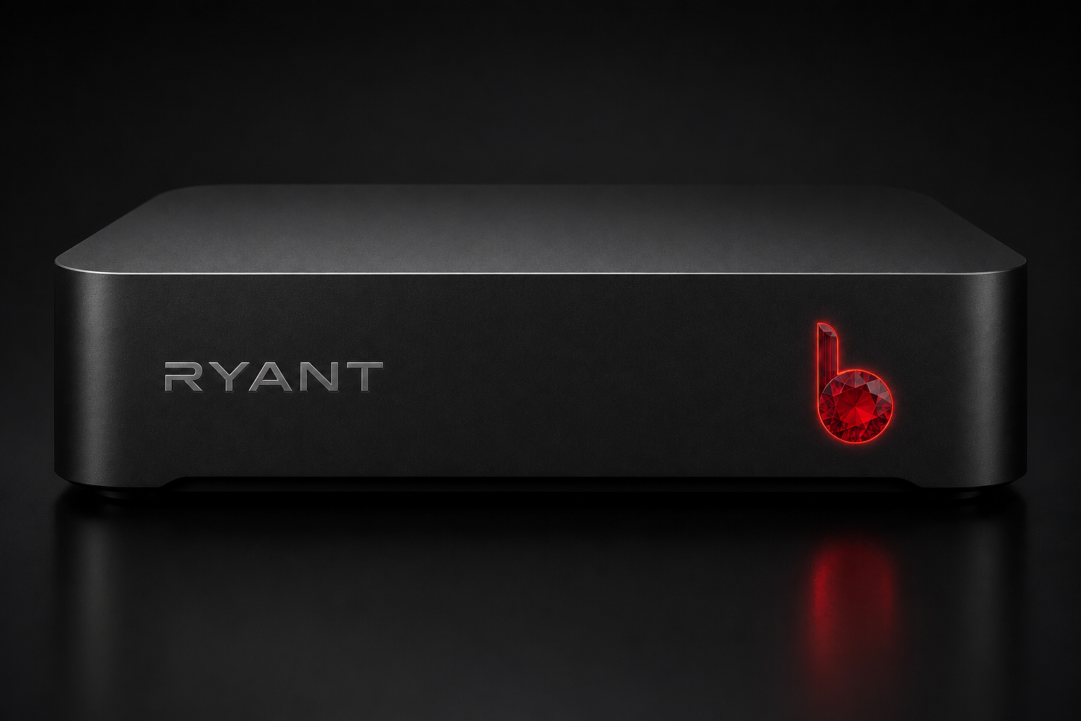 Matte black RYANT edge computing unit with brushed metal branding and a glowing red gemstone power indicator on the right side.